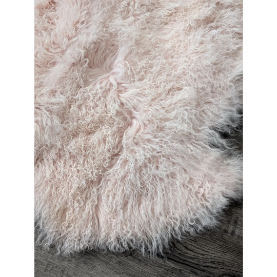 Blush pink 68x45 inch fluffy sheepskin rug by Angus Oliver
