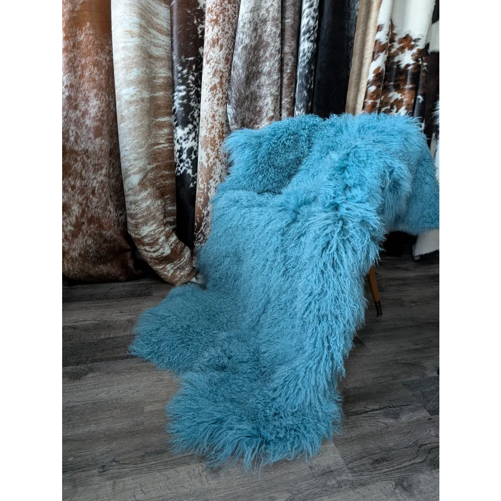 Vibrant turquoise 72x48 aqua quad Mongolian sheepskin rug on chair