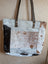 A patchwork cowhide tote bag with brown black and white real cowhide panels stitched together for a stylish look