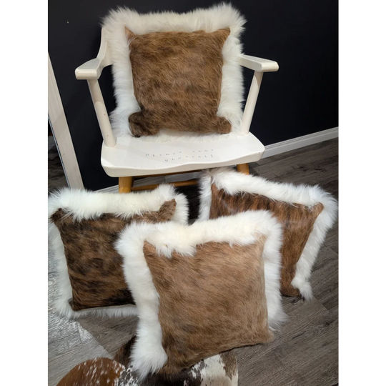Brown cowhide merino sheepskin cushion with plush white fur trim perfect for cozy home decor