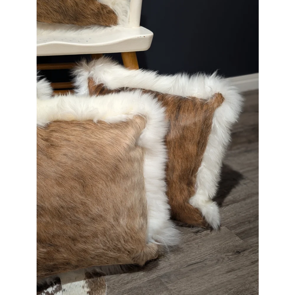 Brown and white cowhide merino sheepskin cushion with fluffy natural fur trim perfect for cozy home decor