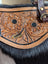 The sunflower weekender bag is a tan leather cartwright hand-tooled bag with intricate floral tooling black fur trim and a zippered pocket