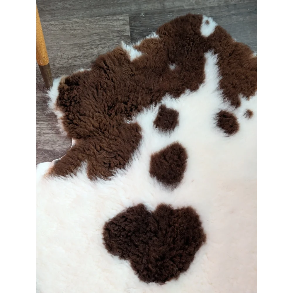 Brown and white highland spotted grade a- sheepskin rug perfect for cozy home decor and comfort