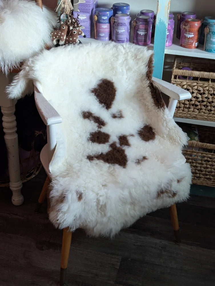 White and brown fluffy sheepskin chair cover made from grade a- tibet highland spotted sheepskins