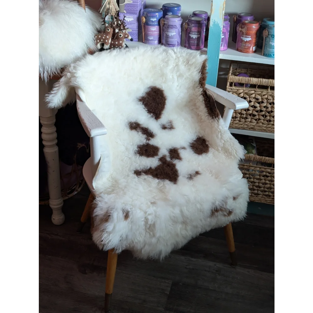 White and brown fluffy sheepskin chair cover made from grade a- tibet highland spotted sheepskins