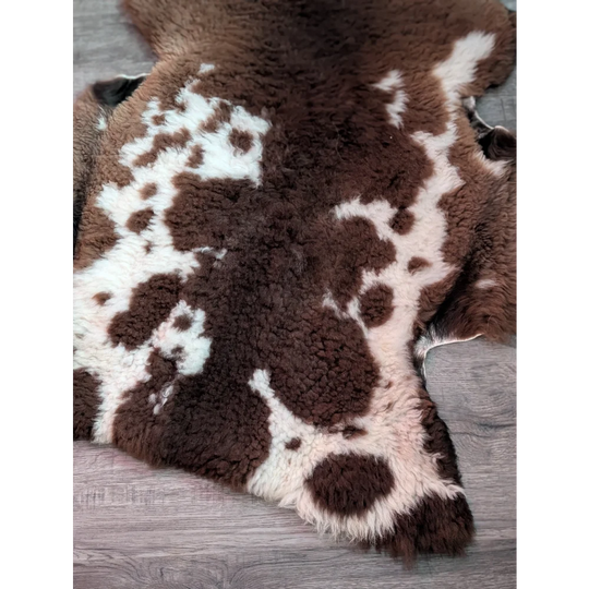Brown and white spotted tibet highland spotted grade a sheepskin rug with plush fluffy texture