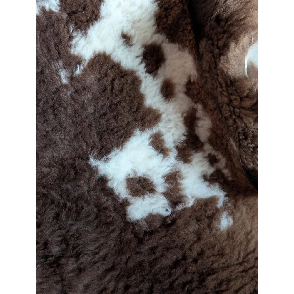 Brown and white fluffy tibet highland spotted sheepskin rug with soft plush texture grade a- sheepskins