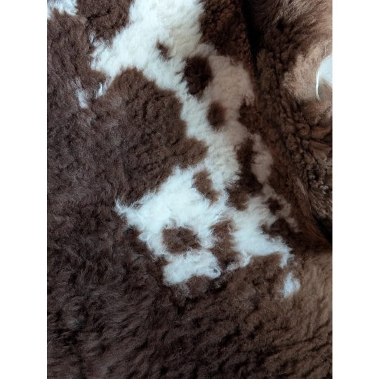 Brown and white fluffy tibet highland spotted sheepskin rug with soft plush texture grade a- sheepskins