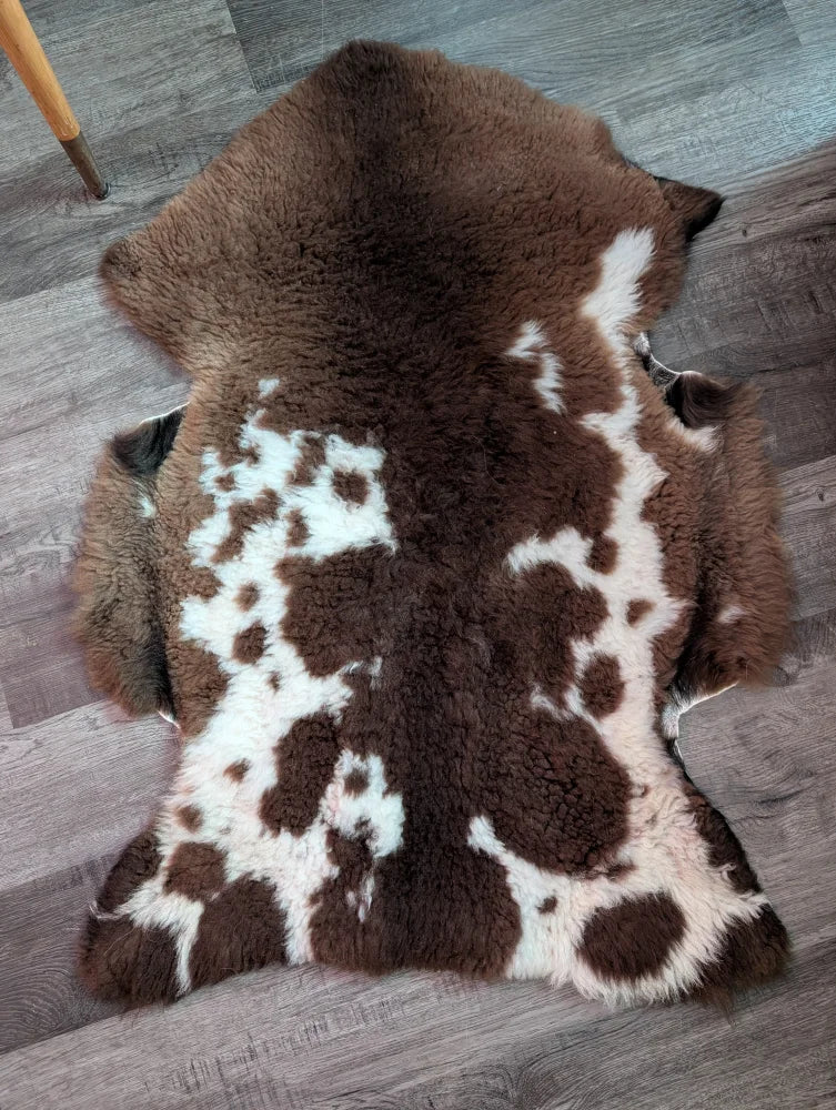 Brown and white tibet highland spotted grade a- sheepskin rug with soft fluffy texture for cozy decor