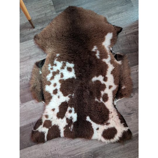 Brown and white tibet highland spotted grade a- sheepskin rug with soft fluffy texture for cozy decor