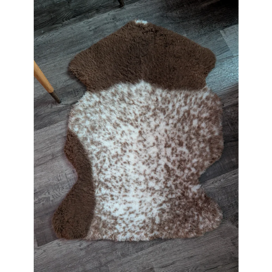 Brown and white tibet highland spotted grade a- sheepskin rug with a natural fluffy texture