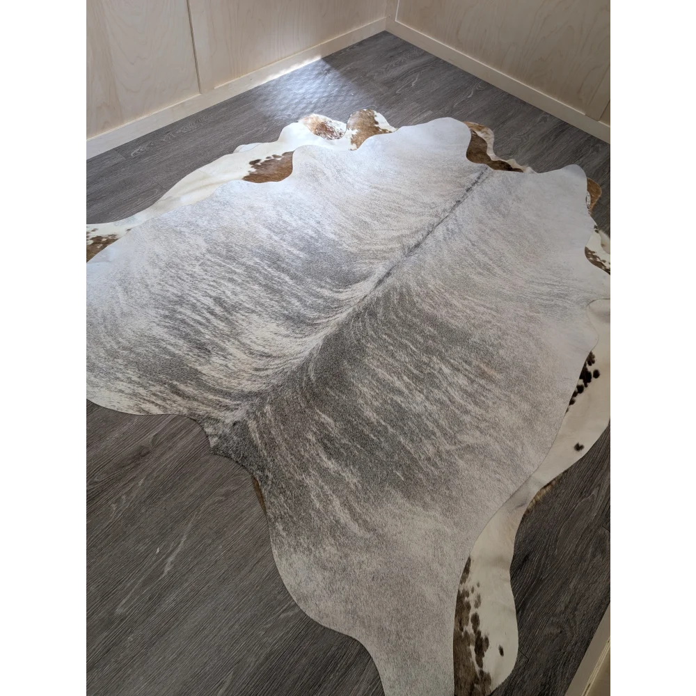 Large cowhide rug 80 x 63 inches with white and gray base brown patches and subtle black speckles perfect for any room