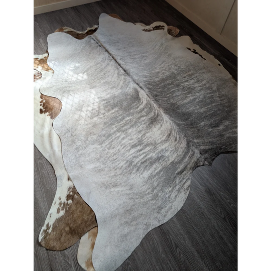 Large cowhide rug 80 x 63 with gray white marbled pattern and brown spots perfect for extra large cowhide decor