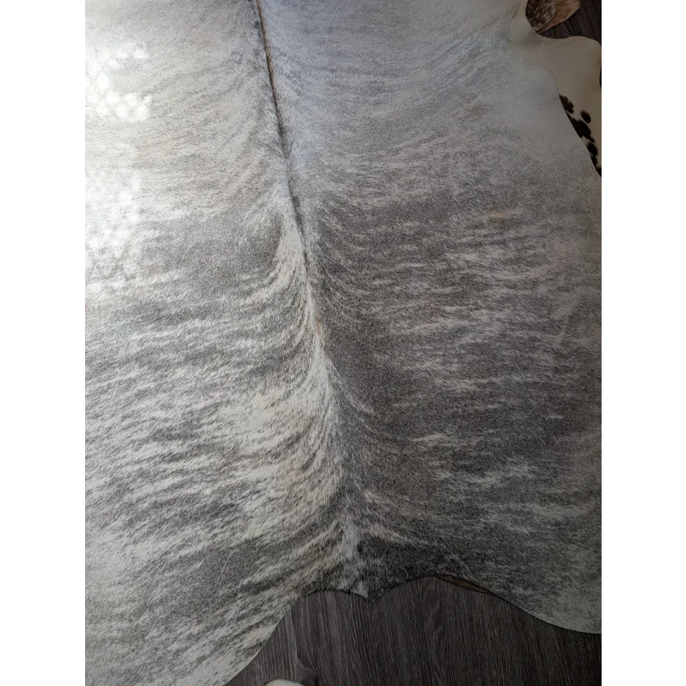 Gray and white extra large cowhide rug with natural textured surface perfect as a large cowhide floor covering