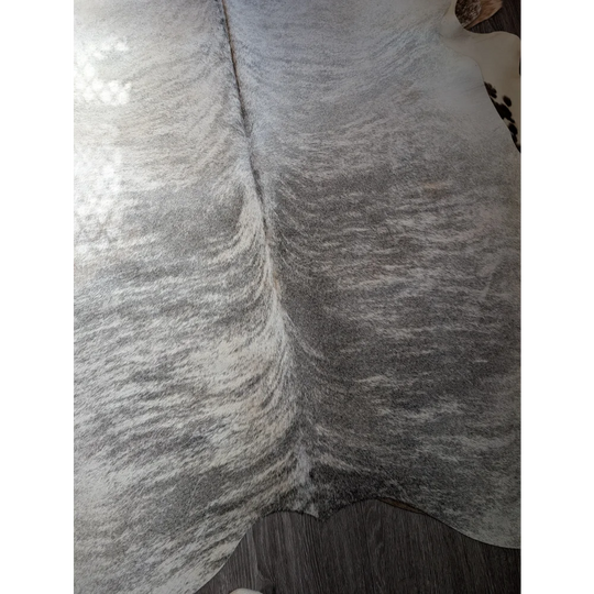Gray and white extra large cowhide rug with natural textured surface perfect as a large cowhide floor covering