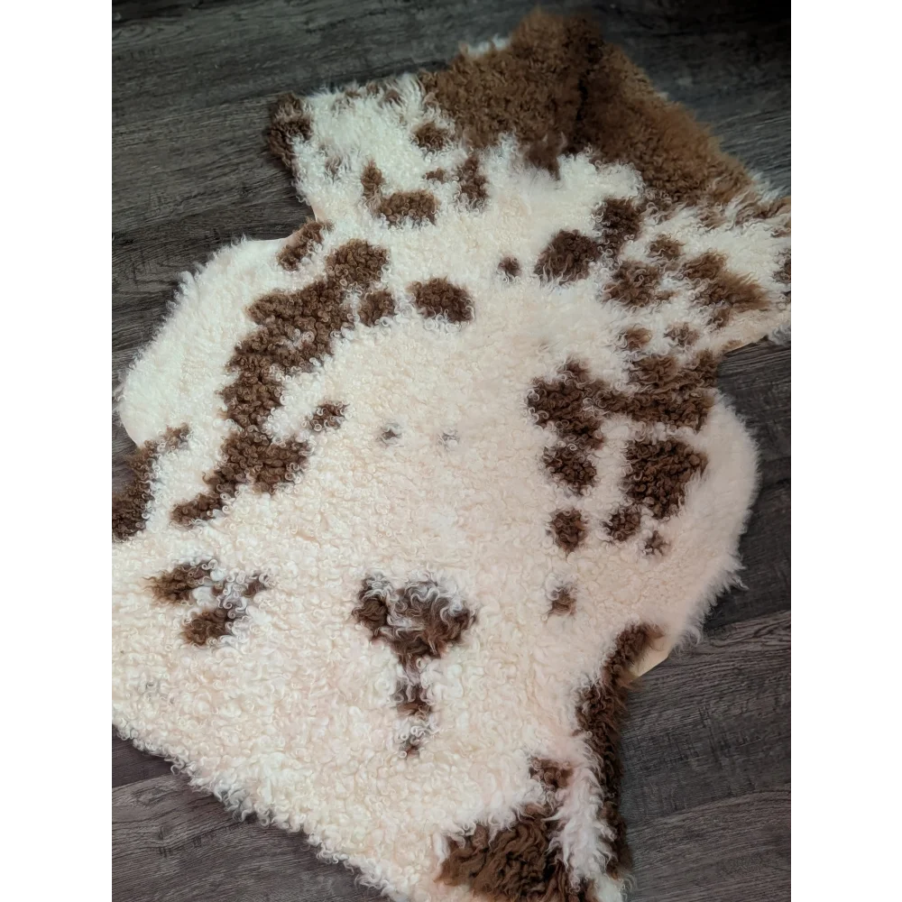 A plush grade a- sheepskin rug with creamy white base and brown patches from tibet highland spotted collection