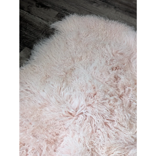 Blush pink 71x47 Angus Oliver sheepskin rug with fluffy curly texture