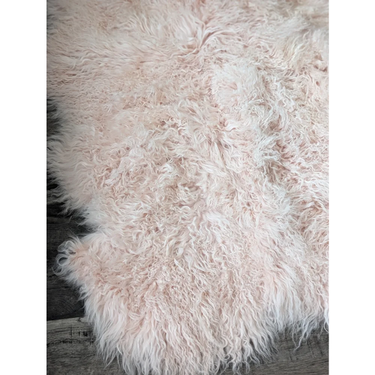 Blush pink Angus Oliver sheepskin rug, 71x47 fluffy Mongolian style