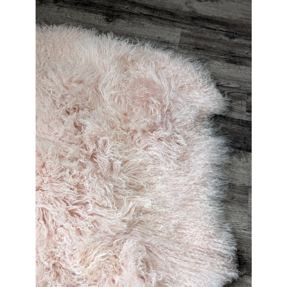 Blush pink Angus Oliver sheepskin rug, 71x47 fluffy curly texture