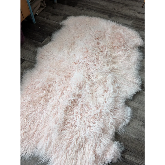 Blush pink Angus Oliver sheepskin rug, plush 71x47 quad size