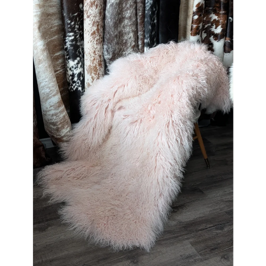 Blush pink 71x47 Angus Oliver sheepskin rug on chair