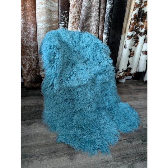 Vibrant turquoise 72x45in aqua quad Mongolian sheepskin rug with fluffy curls