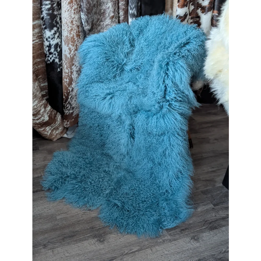 Vibrant turquoise 72x45in aqua quad sheepskin rug with fluffy fibers
