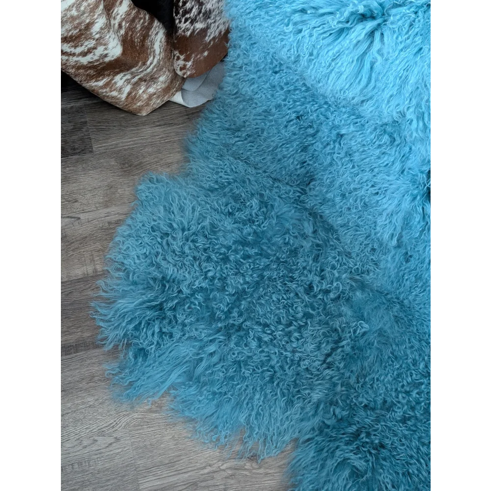 Vibrant 72x45 aqua quad sheepskin rug with curly fibers for natural home decor
