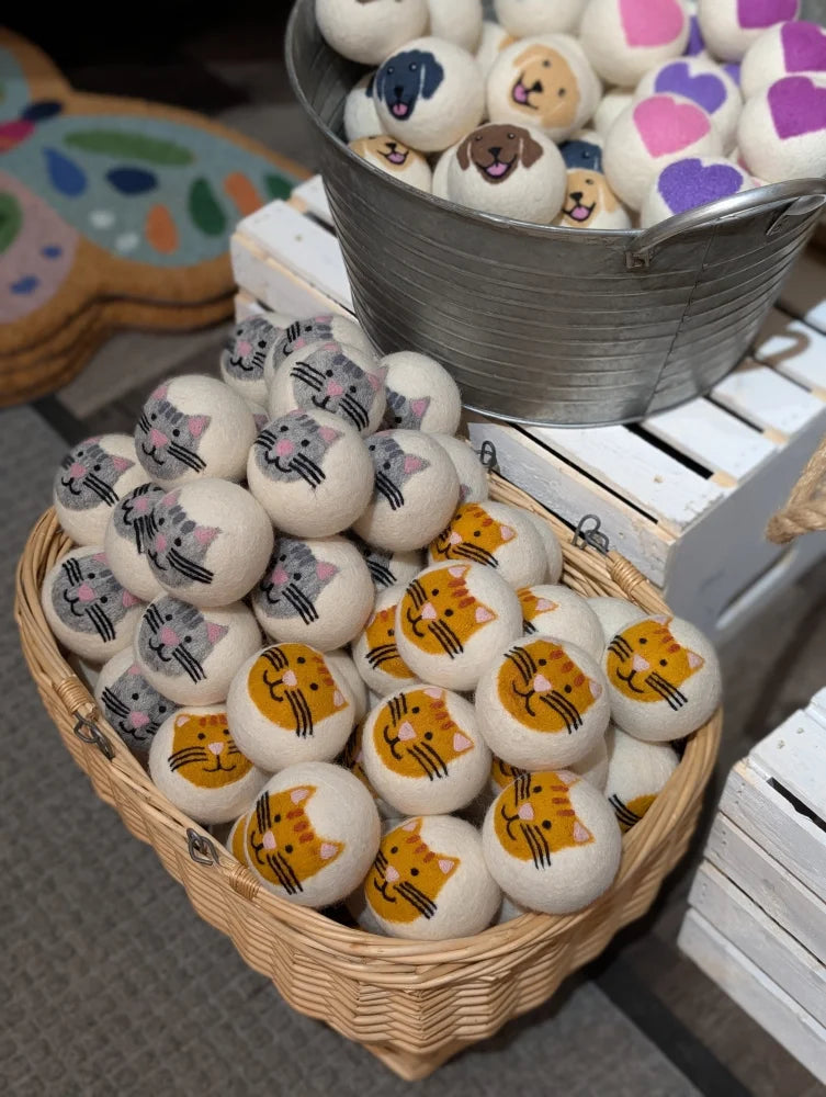 Ceramic cat face egg in basket from 3 Fabulous Cat Dryer Balls