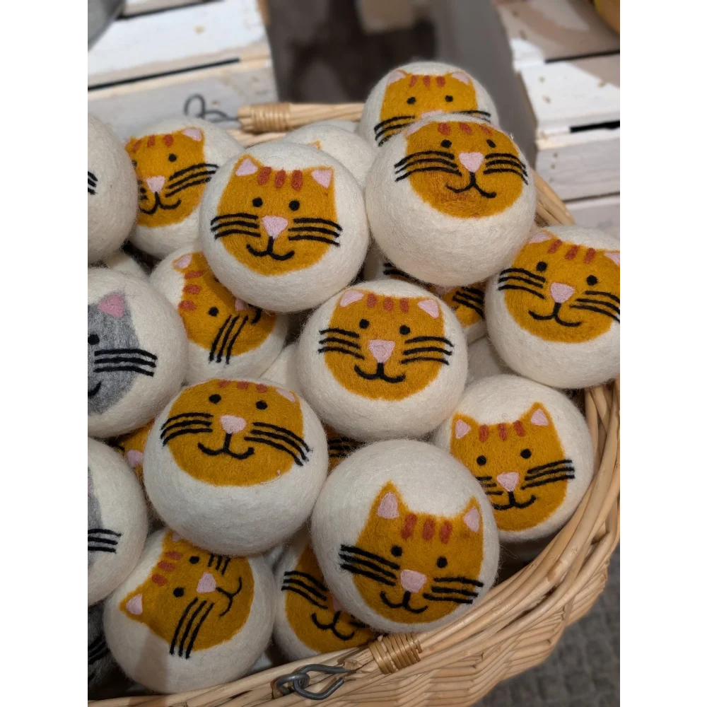 Cute cat face marshmallow ball in basket from 3 Fabulous Cat Dryer Balls