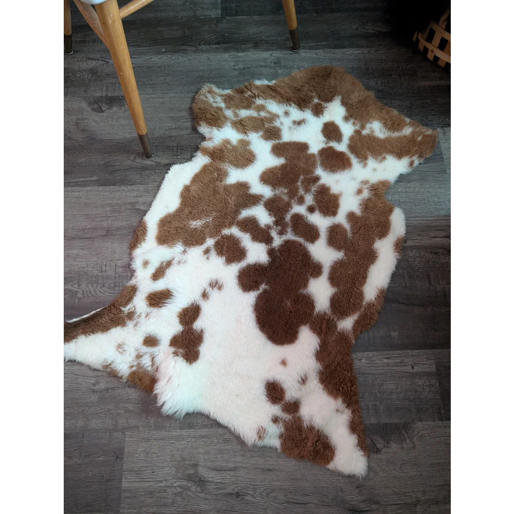 Brown and white highland spotted grade b sheepskin rug with fluffy natural texture perfect as sheepskin rugs