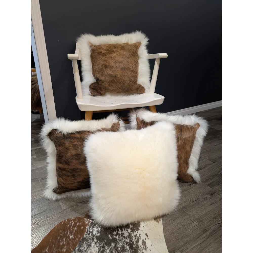 Cream-colored merino sheepskin cushion with plush faux fur texture and fluffy white border cowhide merino sheepskin style