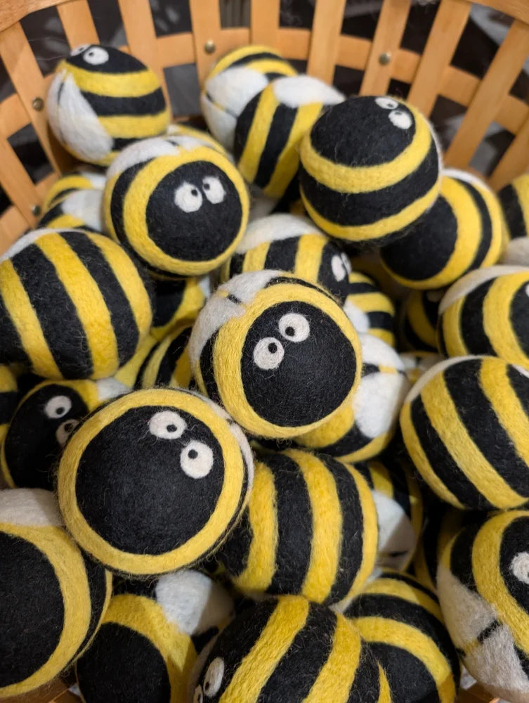 Cute yellow black striped wool bumble bee dryer balls with googly eyes