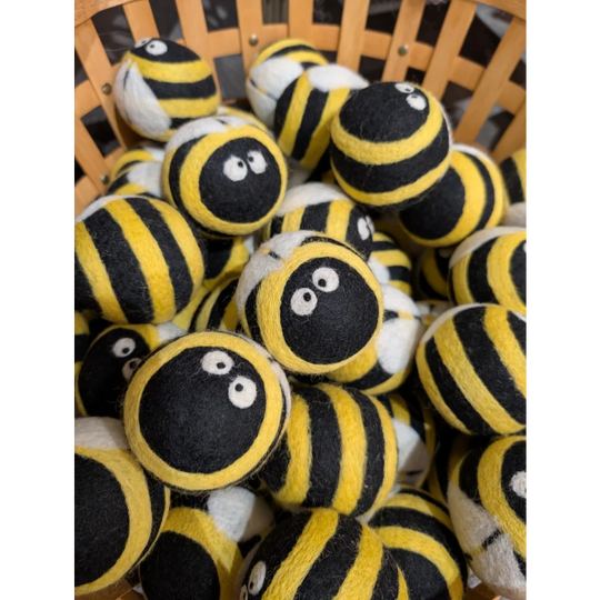Cute yellow black striped wool bumble bee dryer balls with googly eyes