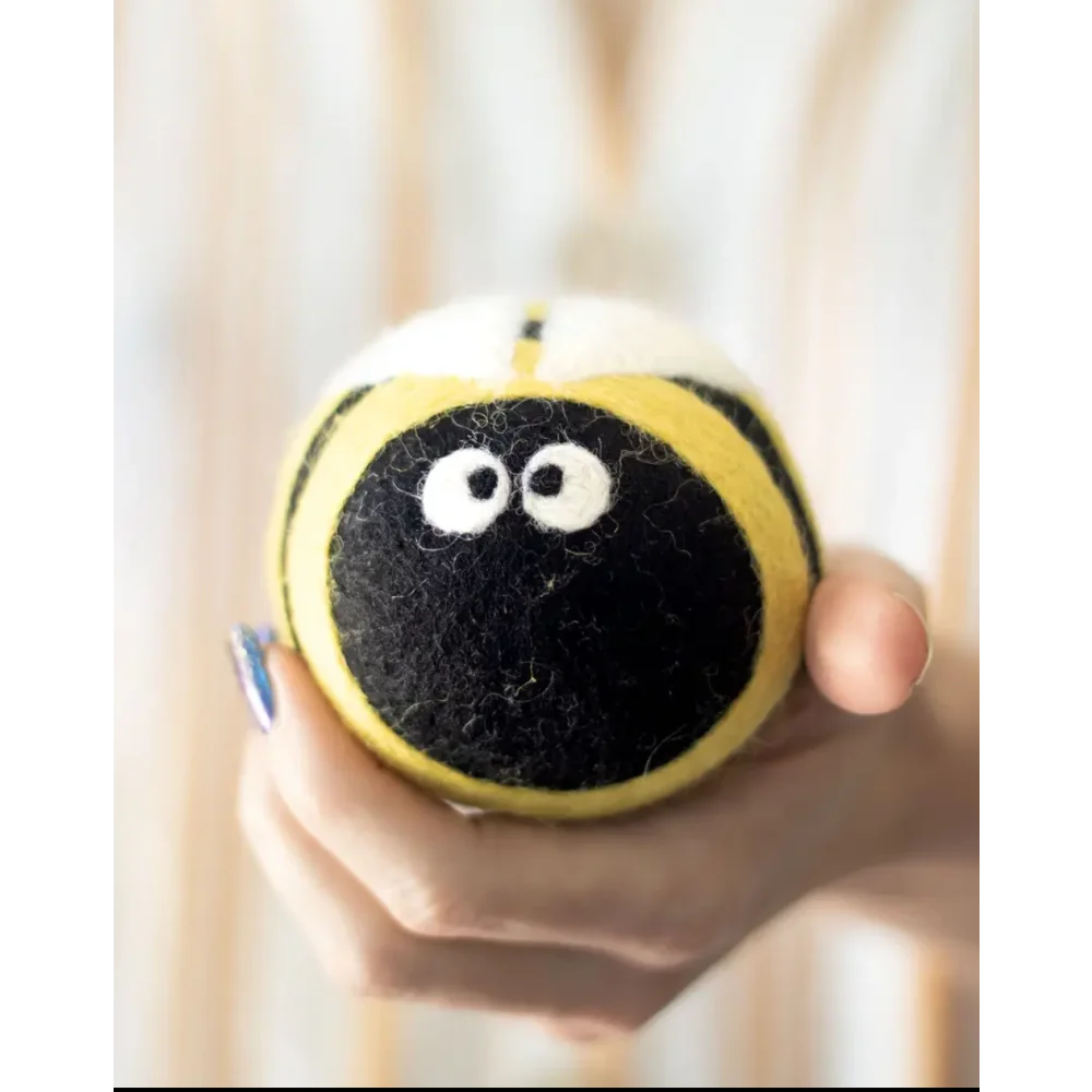 Cute yellow black fuzzy bee plush dryer balls by Angus Oliver