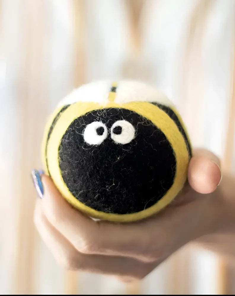 Cute yellow black fuzzy bee plush dryer balls by Angus Oliver