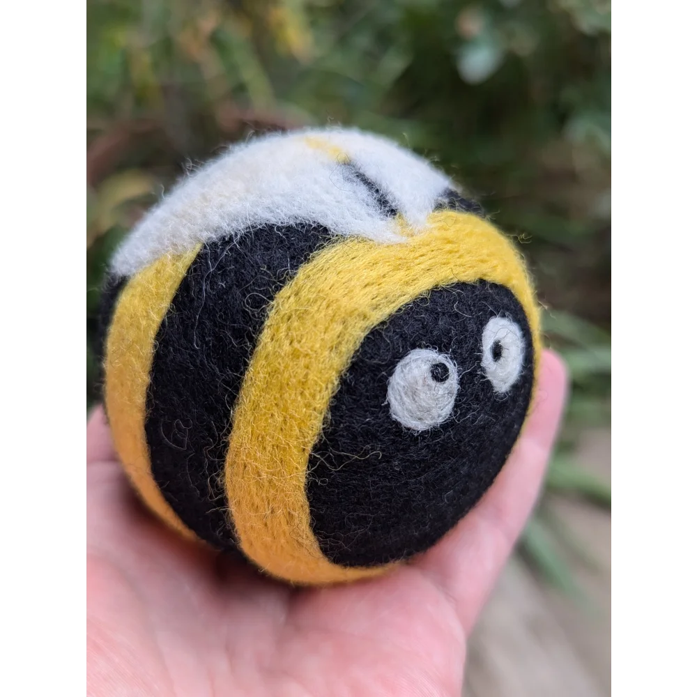 Cute yellow black wool bumble bee dryer balls by Angus Oliver
