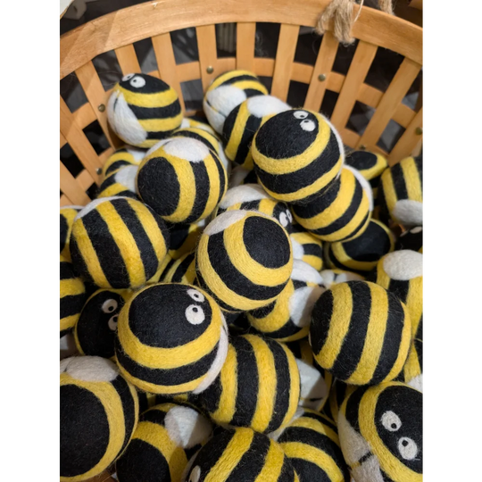 Cute yellow black striped wool bumble bee dryer balls with googly eyes