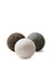Three wool dryer balls in earthy brown gray and off-white made of wool for eco-friendly drying