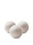 Three off-white fluffy wool dryer balls made of felt for natural laundry drying and softening