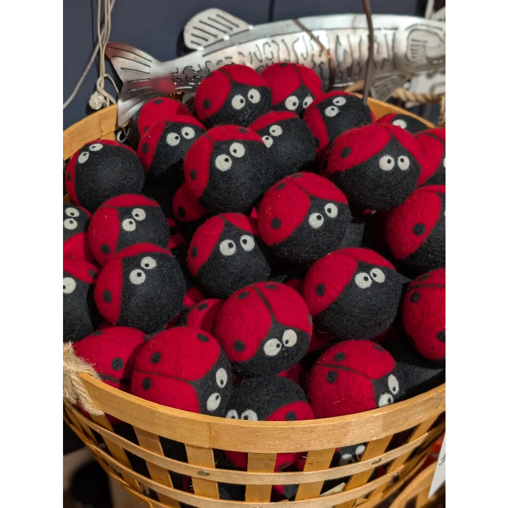 Cute red black ladybug plushies in woven basket with angus oliver sheepskin dryer balls