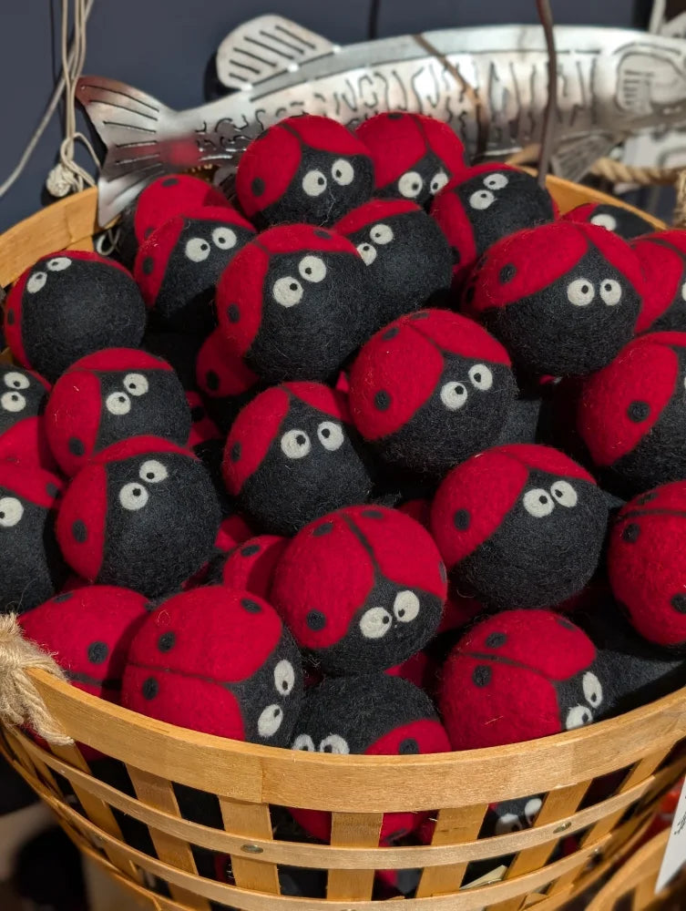 Cute red black ladybug plushies in woven basket with angus oliver sheepskin dryer balls