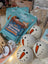 Cute wool snowman dryer balls with carrot noses, black eyes, and sheepskin fluff