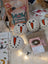 White ceramic snowman dryer balls with carrot noses and black eyes