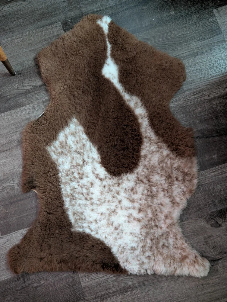 Brown and white tibet highland spotted grade a- sheepskin rug with natural fluffy texture and soft feel
