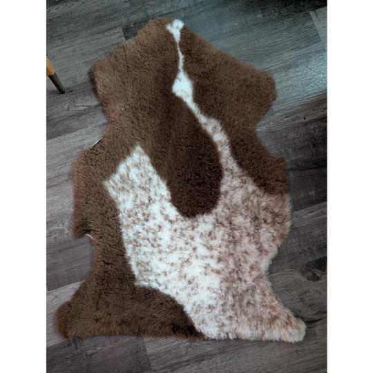 Brown and white tibet highland spotted grade a- sheepskin rug with natural fluffy texture and soft feel