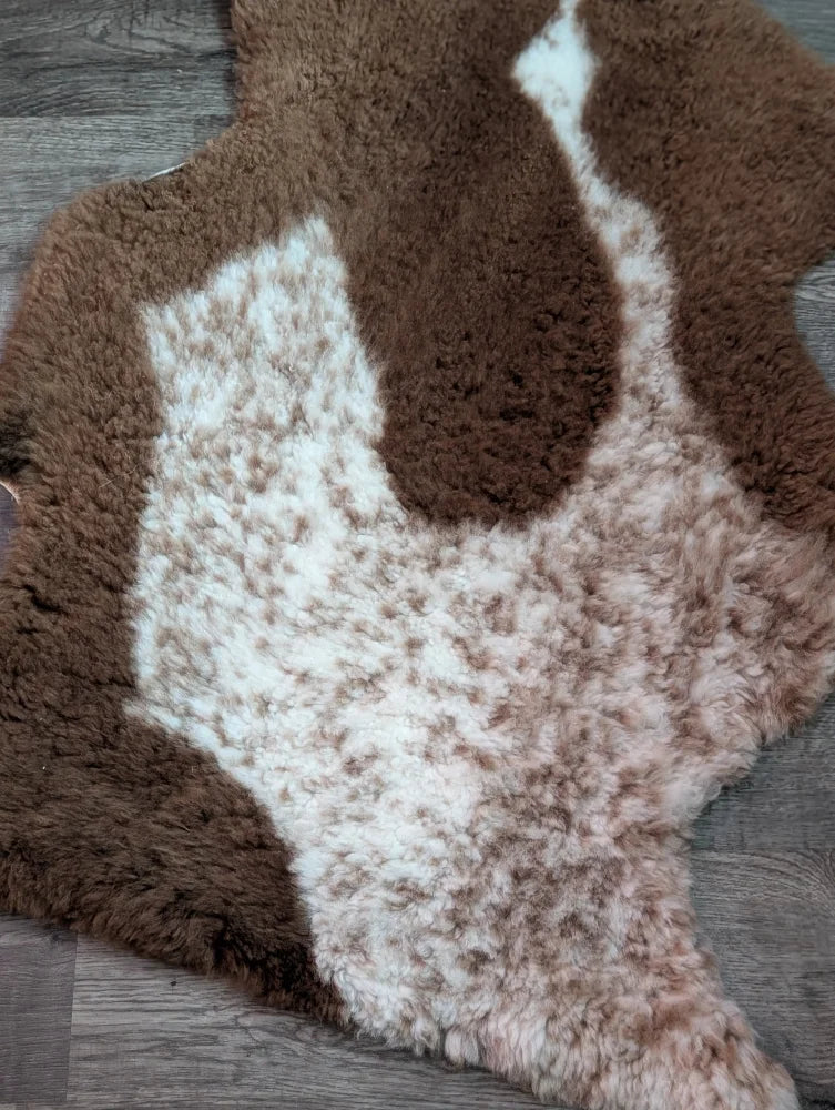 Brown and white tibet highland spotted grade a sheepskin rug with natural fluffy texture