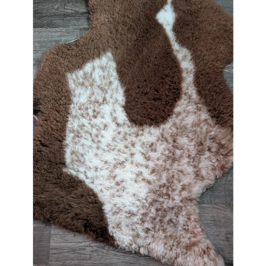Brown and white tibet highland spotted grade a sheepskin rug with natural fluffy texture