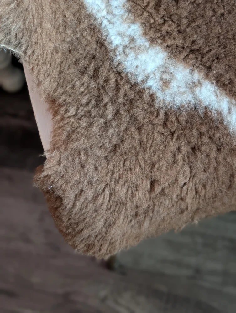 Brown and white fluffy grade a- sheepskins with soft textured surface tibet highland spotted shearling fabric