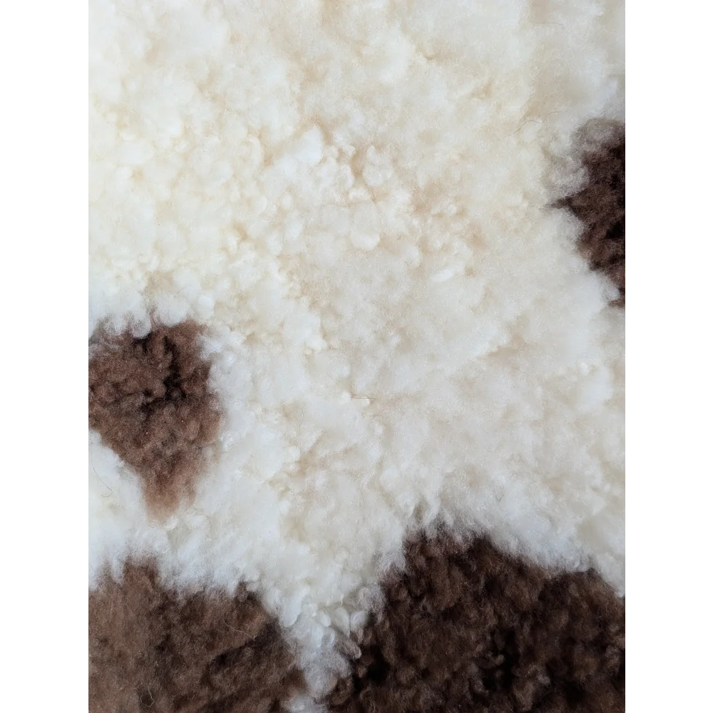 Cream and brown tibet highland spotted sheepskin rug with soft fluffy texture grade a- sheepskins